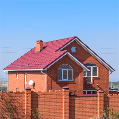 red brick house metal roof